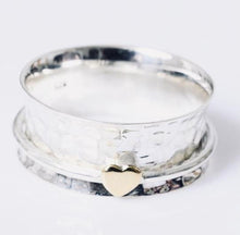 Load image into Gallery viewer, hammered sterling silver ring features a slim band with trio of hearts in silver, copper and brass that spins.  Aphrodite Love Spinning Ring - Silvary 
