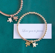 Load image into Gallery viewer, Gold beaded bracelet with two jigsaw shaped charms with personalised initials engraving
