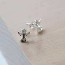 Load image into Gallery viewer, Guardian Angel sterling silver earrings adorned with two cubic zirconia stones, tiny 3d angel wings, dainty silver studs with butterfly backs. Holy communion, christening gift
